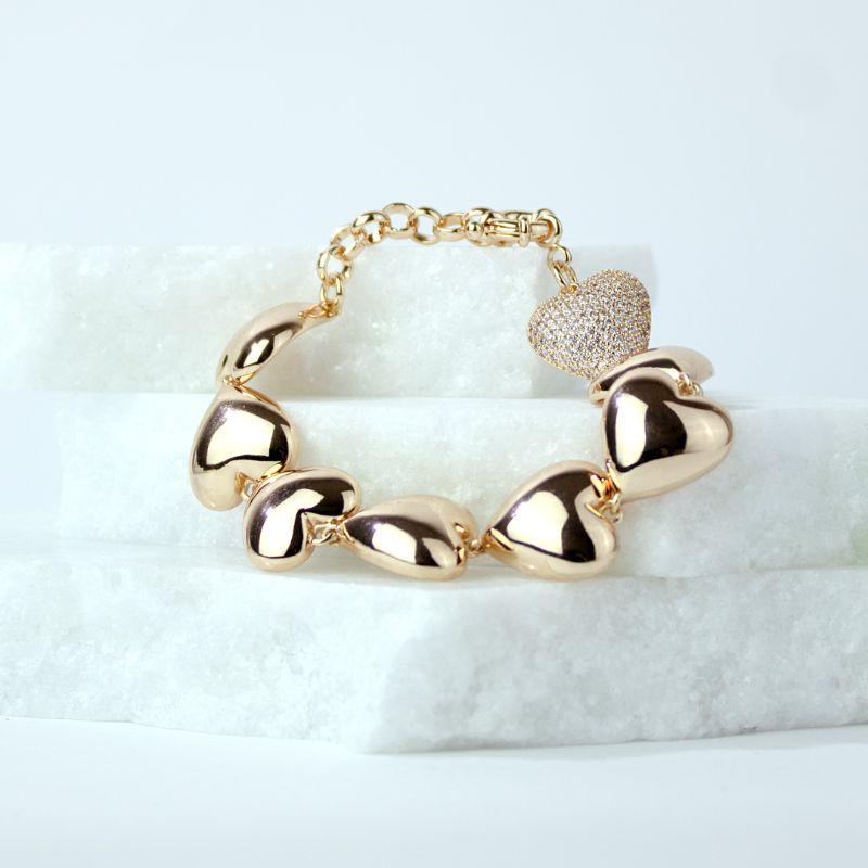 Pulseira Sete Corações Liso e Um Cravejado em Zircônias Banhado a Ouro 18k